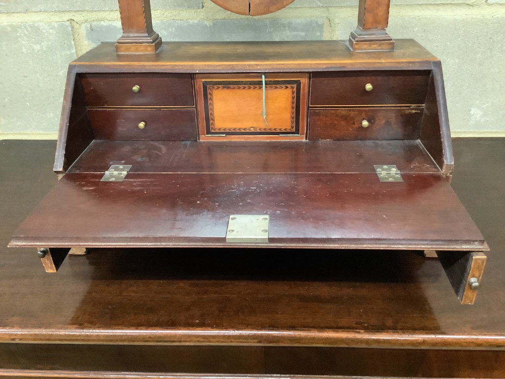 An early 19th century mahogany toilet mirror with bureau base, width 48cm height 76cm